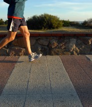 Legs of a young man running